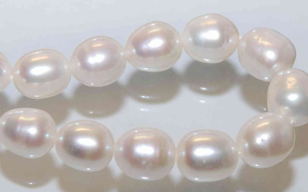 AA 10X12mm LARGE Rice Freshwater Pearl ivory white oval loose pearl beads----HALF strand ---New arrival Sale