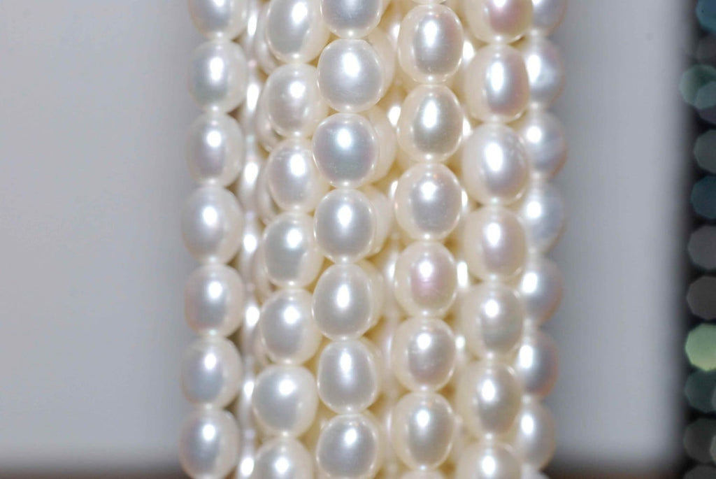 AA- AAA High quality full Strand of 6-7MMX 8mm stunning luster White Ivory Rice oval freshwater Pearl 15"  genuine pearl beads---Deal SALE