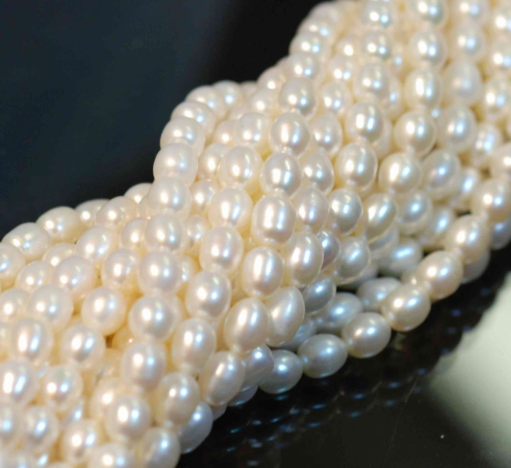 AA- AAA High quality full Strand of 6-7MMX 8mm stunning luster White Ivory Rice oval freshwater Pearl 15"  genuine pearl beads---Deal SALE